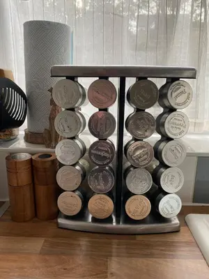 a bunch of coins in a metal container on a table at Comfy and Connected Standish Home - Two Mins from M6 Jct-27 in Standish