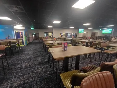 an empty dining room with tables and chairs at Wilerby Winchester in Heysham