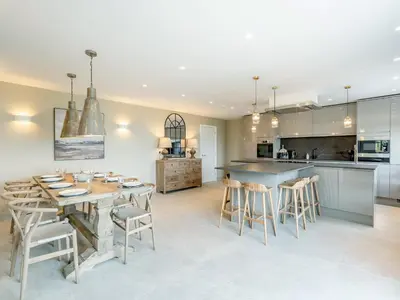 a kitchen and dining room with a table and chairs at Meadow View - Uk49066 in Mellor