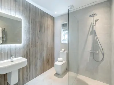a bathroom with a shower and a toilet and a sink at Meadow View - Uk49066 in Mellor