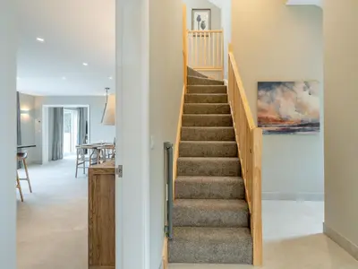 a staircase in a house with a dining room at Meadow View - Uk49066 in Mellor