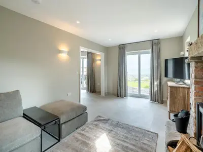 a living room with a couch and a tv at Meadow View - Uk49066 in Mellor