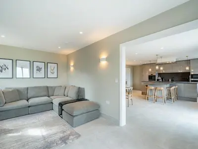 a living room with a couch and a kitchen at Meadow View - Uk49066 in Mellor