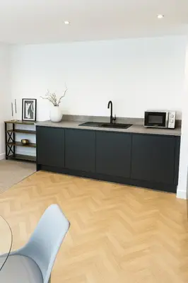 a kitchen with a sink and a microwave at Copper Suite - 2Bed Elegance - Parking in Liverpool