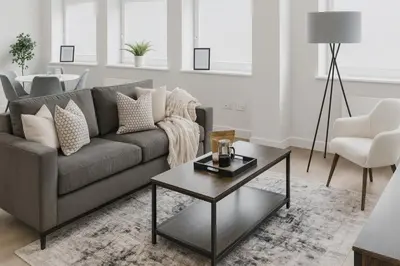 a living room with a couch and a table at Copper Suite - 2Bed Elegance - Parking in Liverpool