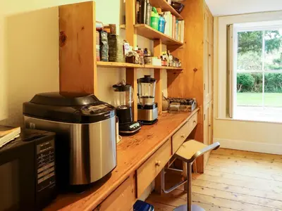 a kitchen with a counter with a coffee maker on it at 1 The Green in Carnforth