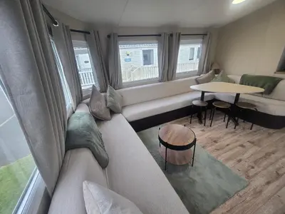 a living room with a couch and a table at 12a Mill View 4 Bed Static Caravan Marton Mere in Blackpool