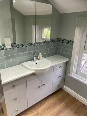 a bathroom with a sink and a mirror at Norwood Manor in Southport