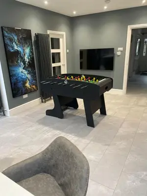 a black pool table in a room with a tv at Norwood Manor in Southport