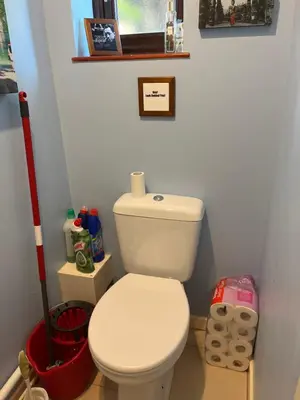 a bathroom with a white toilet in a room at Quiet times away from city noise, but not too far! in Skelmersdale