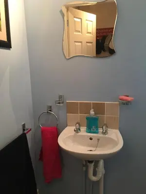 a bathroom with a sink and a mirror at Quiet times away from city noise, but not too far! in Skelmersdale