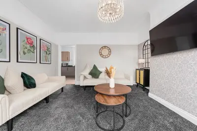 a living room with a couch and a table at Free Parking Stunning 3Bedroom Home In Wigan in Wigan
