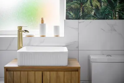 a bathroom with a sink and a toilet at Free Parking Stunning 3Bedroom Home In Wigan in Wigan