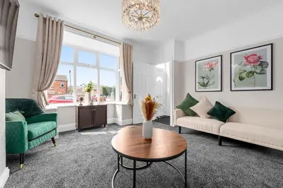 a living room with a couch and a table at Free Parking Stunning 3Bedroom Home In Wigan in Wigan