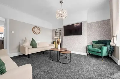 a living room with a couch and a table at Free Parking Stunning 3Bedroom Home In Wigan in Wigan