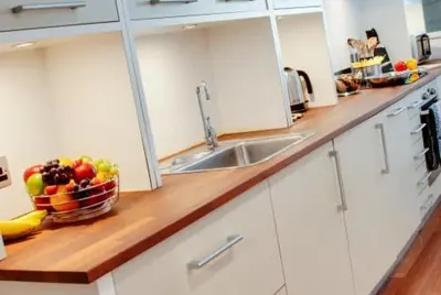 a kitchen with a bowl of fruit on a counter at 3 Bedroom Apartment Central Liverpool in Liverpool