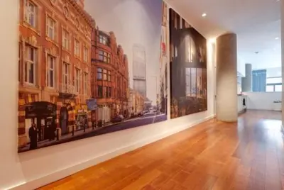 a room with a large painting on the wall at 3 Bedroom Apartment Central Liverpool in Liverpool