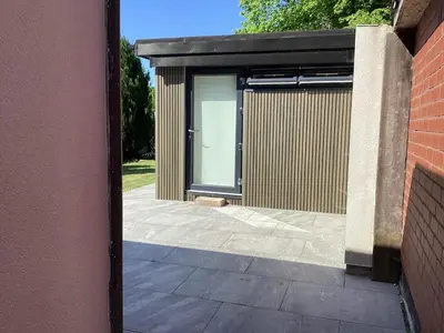 a building with a door on the side of it at Golf view lodge in Lostock