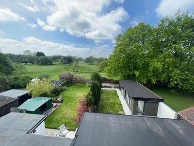an aerial view of a house with a yard at Golf view lodge in Lostock