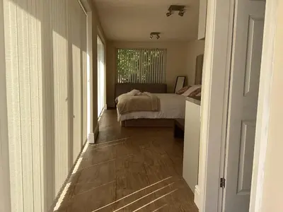 a bedroom with a bed and a window at Golf view lodge in Lostock