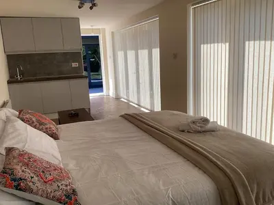 a bedroom with a large bed and a large window at Golf view lodge in Lostock