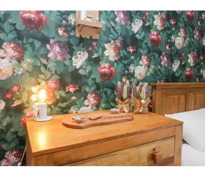 a table with a cutting board and cactus on it at Willow Cottage Haverigg Millom in Haverigg