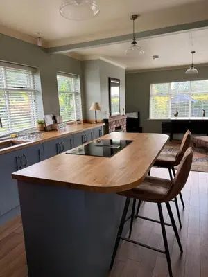 a kitchen with a large wooden table and chairs at Oaken Fields, Waddington, Clitheroe in Waddington