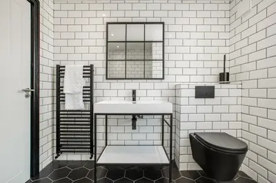 a white bathroom with a sink and a toilet at New Mixies Manor in Blackpool