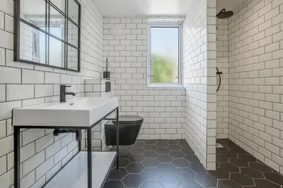 a white bathroom with a sink and a toilet at New Mixies Manor in Blackpool