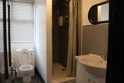 a bathroom with a toilet and a sink and a shower at 80 Anfield house in Liverpool