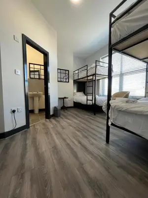 a room with two bunk beds and a bathroom at 80 Anfield house in Liverpool