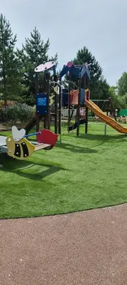 a playground with a toy plane on the grass at Private Caravan to Hire - Marton Mere Haven Holiday Village in Blackpool