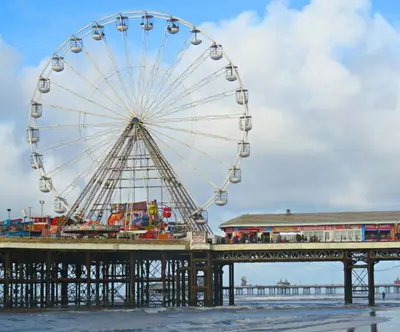 a ferris wheel sitting on top of a pier at Private Caravan to Hire - Marton Mere Haven Holiday Village in Blackpool