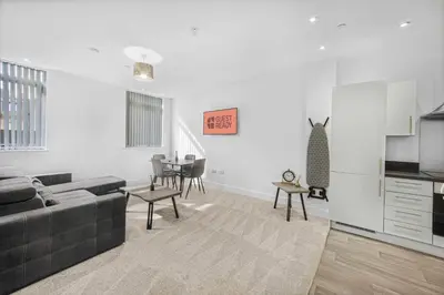 a living room with a couch and a table at GuestReady - Gladstone in Liverpool