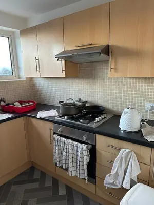 a kitchen with a stove with pots and pans on it at Cozy apt with good location in Garstang