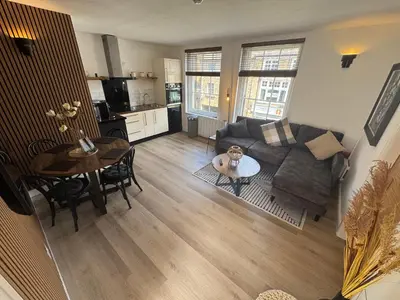 a living room with a couch and a table at The Hideaway - 2-Bedroom Apartment with outdoor terrace & free parking in Lancaster