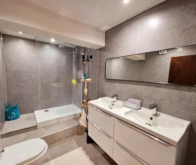 a bathroom with a sink and a toilet and a tub at Liverpool Georgian Quarter Apartment in Liverpool