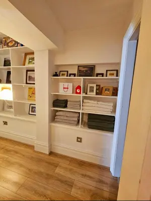 a room with white shelves in a wall at Liverpool Georgian Quarter Apartment in Liverpool