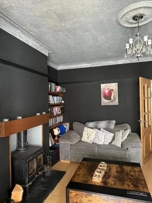 a living room with a couch and a fireplace at Beachside Home-Pizza Oven & Bar Close To Beach and Town in Cleveleys