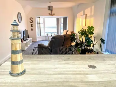 a lighthouse in the middle of a living room at Top Floor Apt Promenade Sea Views Sleeps 6 Shore Vibes in Morecambe