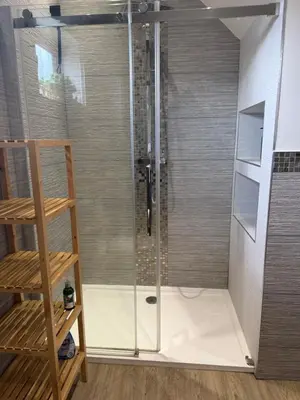 a shower with a glass door in a bathroom at Birkdale Links Lodge in Southport