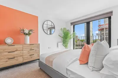 a bedroom with a bed and a window at The Vintara Suite - Central - 2Bed - Cozy Stay in Liverpool