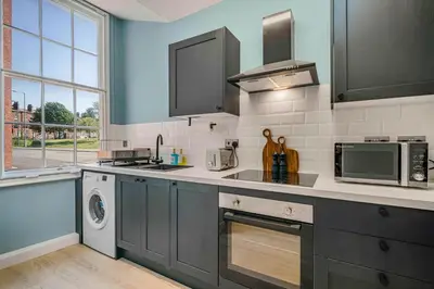 a kitchen with a sink and a dishwasher at GuestReady - Stylish getaway in Liverpool in Liverpool