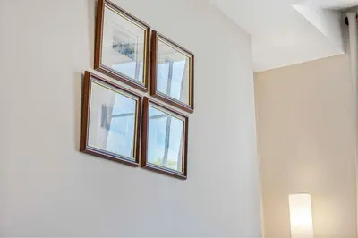 a group of three windows on a wall at GuestReady - Stylish getaway in Liverpool in Liverpool