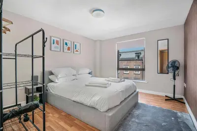 a bedroom with a bed and a window at GuestReady - Modern stay in Liverpool city centre in Liverpool