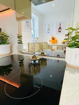 a room with a glass table and some plants at New - The Fun House Blackpool - Private nightclub in Blackpool