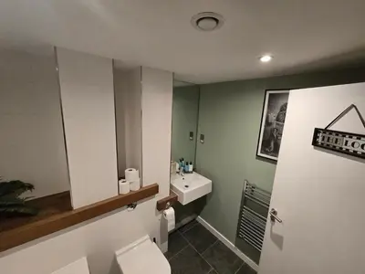 a bathroom with a toilet and a sink at Ventro Apartments LIVERPOOL in Liverpool