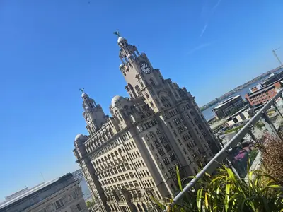 a tall building with a clock tower on top of it at Ventro Apartments LIVERPOOL in Liverpool