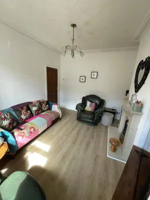 a living room with a couch and a chair at Alices House in Fleetwood