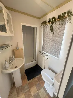 a bathroom with a white toilet and a sink at Seaside Getaway - Lytham Road in Warton